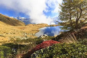 Cloud Sky Prints: Clouds on peaks of Bernina Group reflected in Lake Arcoglio, Val Torreggio, Malenco Valley