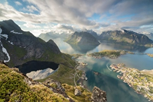 Moskenesoya Prints: Clouds reflected in blue lake and sea framed by rocky peaks, Reinebringen, Moskenesoya