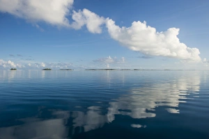 Tuamotus Prints: Clouds reflecting in the calm waters of Tikehau, Tuamotus, French Polynesia, Pacific