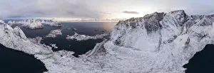 Olstind Prints: Clouds over Reinevatnet Lake, Reinebringen and Olstind mountain peaks covered with snow