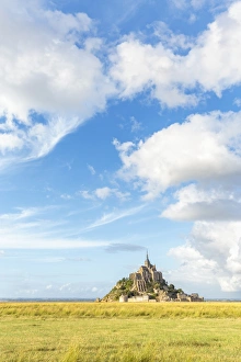 Clouds in the sky and grass in the foreground, Mont-Saint-Michel, UNESCO World Heritage Site