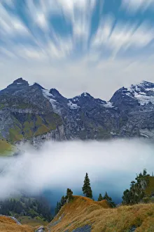 Kandersteg Prints: Clouds in the sky above lake Oeschinensee covered by fog, Bernese Oberland, Kandersteg