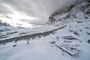 Holidays Gallery: Clouds over the snowy slopes of Sella Pass ski area, Val Gardena, Dolomites