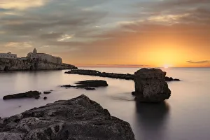 Apulia Prints: Clouds at sunrise over the calm sea surrounding Vieste, Foggia province