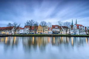 River Trave Prints: Clouds on the typical houses and towers of cathedral reflected in River Trave at dusk