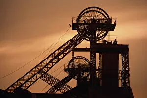 Generic Location Collection: Coalmine pithead silhouetted at dusk