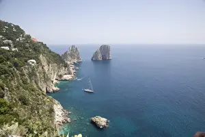 Capri Prints: The coast line of the island of Capri, with the famous Faraglioni rocks on the back ground