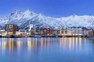 Nordland County Gallery: Coastal town of Svolvaer framed by snowcapped mountains at dusk, Nordland county, Lofoten Islands