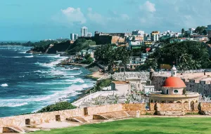 Crashing Prints: Coastal view of Old San Juan featuring blue waters