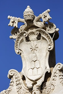 The coats of arms of the Holy See and Vatican City State, St. Peters Square (Piazza San Pietro) The coats of arms of the Holy See and Vatican City State, St. Peters Square (Piazza San Pietro)