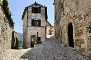 Hilly Prints: Cobbled alley in the picturesque medieval village of Lacoste, Provence, France, Europe