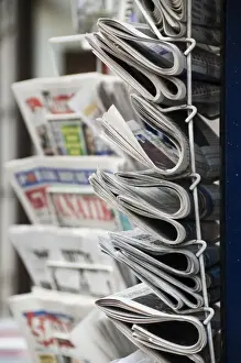 Rack Prints: A collection of international newspapers on sale in Fleet Street, London