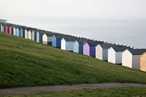 Huts Prints: Colored beach huts on the beach of Tankerton near Whitstable in Kent