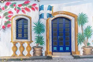 Creative Prints: Colorful building painting showcasing local design in Chersonisos village