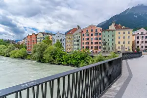 Innsbruck Prints: Colorful buildings along River Inn under sunny skies in summer in Tyrol Region
