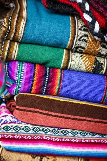 Colorful carpets made of llama and alpaca wool for sale at San Pedro market, Cuzco, Peru