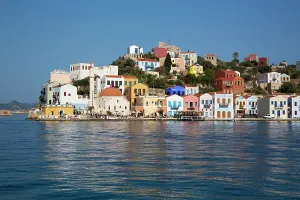Dodecanese Prints: Colorful houses and historic buildings by the harbor in Megisti Bay