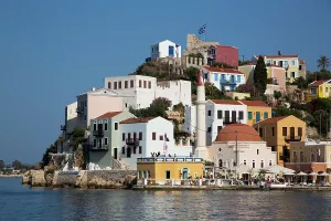Daily Prints: Colorful houses and a mosque near the harbor in Megisti Bay in Kastellorizo showing daily life in Greece