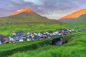 House Exterior Prints: Colorful houses of the village of Gjogv with the mounatins lit by the early sun