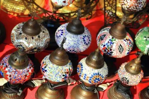 Stalls Prints: Colorful lamp stall at Dubai Creek showcasing various designs and styles for visitors viewing and purchasing