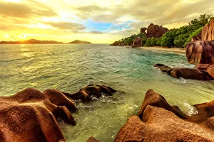 Rippled Prints: Colorful sky at twilight Anse Source d Argent Beach, La Digue, Seychelles, Indian