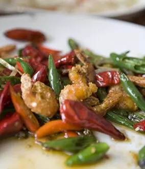 Colorful and spicy Sichuan cuisine shrimp dish uses both red and green chili peppers