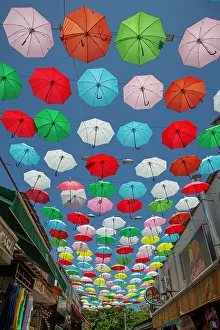 Businesses Prints: Colorful umbrellas create shade and beauty on Umbrella Street in Antalya