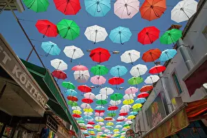 Hanging Prints: Colorful umbrellas hanging over a lively street in Antalya