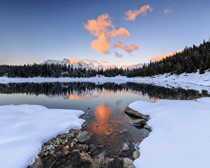 Lake Palu Prints: The colors of dawn on the snowy peaks and woods reflected in Lake Palu, Malenco Valley
