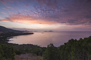 Cagliari Prints: The colors of sunrise are reflected on the sea around the beach of Solanas, Villasimius