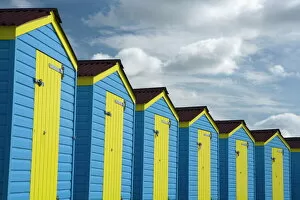 Senior Woman Collection: Colourful beach huts, Littlehampton, West Sussex, England, United Kingdom, Europe