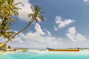 A colourful boat on the beautiful Island Pelicano in the San Blas Islands, Kuna Yala A colourful boat on the beautiful Island Pelicano in the San Blas Islands, Kuna Yala