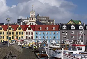 Quay Side Prints: Colourful boats and picturesque gabled buildings along the quayside in Vestaravag harbour
