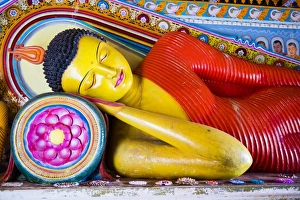 Colourful Buddha statue at Isurumuniya Vihara, Anuradhapura, UNESCO World Heritage Site, Sri Lanka, Asia