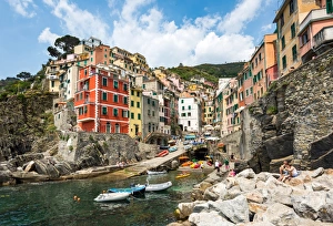 The colourful buildings and boats in Riomaggiore harbour, Cinque Terre, UNESCO World Heritage Site