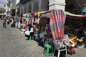 Ecuador Gallery: Colourful clothing and textiles for tourists in the market on Plaza San Francisco