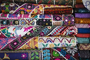 Stacked Prints: Colourful hand woven fabrics at Mapusa Market, Goa, India, Asia