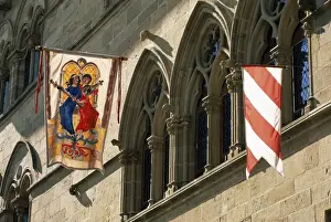 Colourful hangings outside the Maison du Grand Fauconnier, Cordes-sur-Ciel