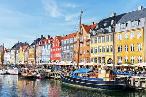 What's New: Colourful houses and wooden boats in Nyhavn harbour, Copenhagen, Denmark, Scandinavia, Europe