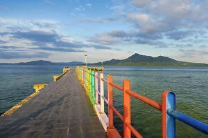 : The colourful jetty at this popular coral fringed holiday island and scuba diving destination
