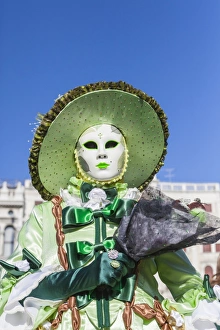 Disguise Prints: Colourful mask and costume of the Carnival of Venice, famous festival worldwide, Venice