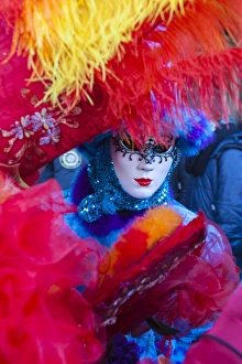Colourful mask and costume of the Carnival of Venice, famous festival worldwide, Venice
