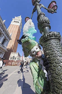 Colourful mask and costume of the Carnival of Venice, famous festival worldwide, Venice