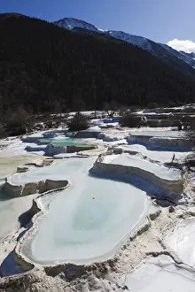 Mother Nature Prints: Colourful pools of calcite deposit frozen at Huanglong National Park