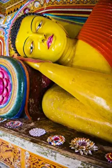 5th Century Prints: Colourful reclining Buddha statue at Isurumuniya Vihara