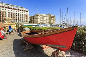 Rowing Boat Prints: Colourful rowing boats under repair at the marina Borgo Marinaro