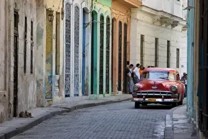 Old Havana Prints: Colourful street with traditional old American car parked, Old Havana, Cuba