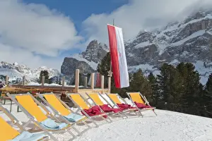 Tirol Prints: Colourful sun loungers outside a mountain restaurant, Sella Ronda ski area
