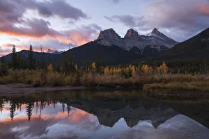 Fall Prints: Colourful sunrise over Three Sisters at Policeman Creek in autumn, Canmore, Banff