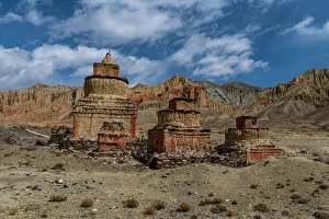 Colourfully painted Buddhist stupa, in an eroded mountain landscape, Kingdom of Mustang, Himalayas, Nepal, Asia